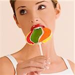 Young woman eating a lollipop