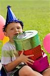 Portrait of a boy holding gifts