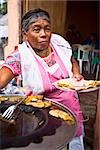 Portrait of a senior woman holding a plate of Mexican food, Cuetzalan, Puebla State, Mexico