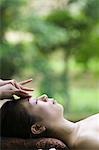 Young woman having head massage