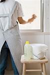 A woman cleaning window, blurred motion