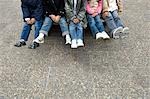 Low section of children sitting