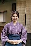 Young woman standing in front of restaurant