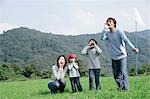 Family shouting in meadow