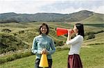 Two young women with megaphones