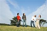 Four young people laughing