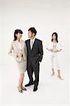 Businesswoman looking at couple