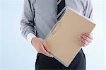 Businessman holding clipboard