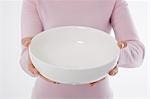 Woman holding empty bowl