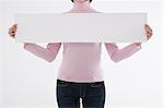 Woman holding blank paper
