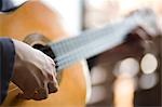 Young man playing acoustic guitar