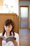 Young woman reading book