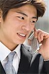 Young businessman talking over mobile phone