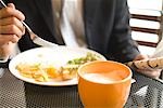 Businessman eating breakfast