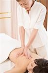 Young woman having body massage