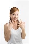 Young woman showing fingernails