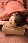 Young woman lying at bedrock bath