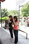 Two young women praying at temple