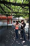 Two women reading fortune paper