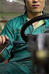 Young man using forklift