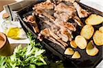 Meat and Potatoes Cooking on an Electric Grill