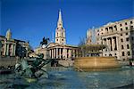 Water fountains, statues and architecture of Trafalgar Square, including St. Martin in the Fields, London, England, United Kingdom, Europe