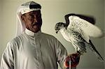 Portrait of falcon handler and Gyr Falcon, Bahrain, Middle East