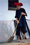 Portrait of an elderly Samsui woman with broom sweeping, in Singapore, Southeast Asia, Asia