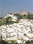 Church and white village perched on mountainside, Casares, Malaga, Costa del Sol, Andalucia (Andalusia), Spain, Europe