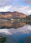 Eilean Donan castle reflected in calm water of Loch Duich from Totaig, Dornie, Highland region, Scotland, United Kingdom, Europe