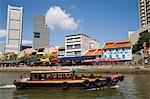 Bumboat River Taxi passing bars and restaurants in historic shophouse buildings in Boat Quay Conservation Area on south bank, Central area, Singapore, Southeast Asia, Asia