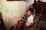 Young children weaving carpets for up to 16 hours a day in carpet factories, Jawlikhel, Kathmandu, Nepal, Asia