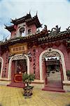 Exterior of a Chinese temple with ornate roof and walls in Hoi An, Vietnam, Indochina, Southeast Asia, Asia