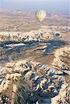 Hot air ballooning over rock formations, Cappadocia, Anatolia, Turkey, Asia Minor, Asia