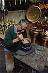 Portrait of a craftsman at work in a copper souk, Khan el Khalili Bazaar, Cairo, Egypt, North Africa, Africa
