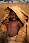 Portrait of young African child, smiling and looking at the camera, Kagenyi Camp, Zanzibar, Tanzania, East Africa, Africa