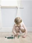 little boy playing with toy soldiers