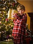 boy shaking a christmas present