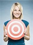 woman holding up a target