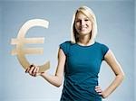 woman holding up a euro symbol