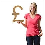 woman holding up british pound symbol