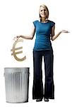 woman throwing euro symbol in the trash