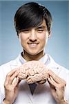 scientist holding a brain