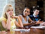 woman on her cell phone during a meeting