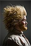 profile of man with crazy hair