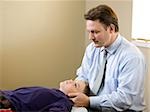 chiropractor treating a patient