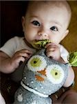 baby girl playing with a toy