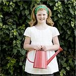 girl holding a watering can