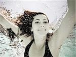 woman swimming underwater in a pool