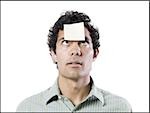 man with a post it note on his forehead